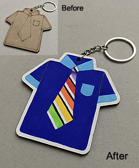 Art supplies / kids birthday party ideas / gift ideas: 'Before' picture: A wooden key chain cut and printed into a short-sleeve shirt with a neck tie. 'After' picture: The shirt is painted in ultramarine blue with light blue coloured breast pocket & collar. The cuffs of the short sleeves are also painted with light blue. The tie is painted in stripes with black & rainbow colours.