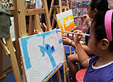 Canvas painting booth at family art event