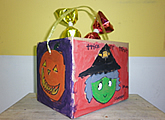 Halloween Trick-or-Treat bucket painted by a kid in our Halloween events and activities for kids.